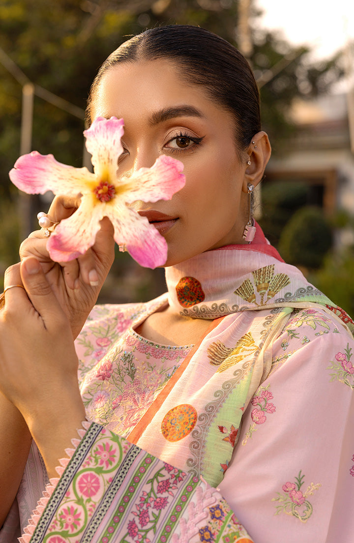 Close-up of Blush Bloom fabric and pastel embroidery