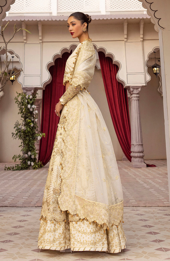 Side profile of model in Gull e Rana dress