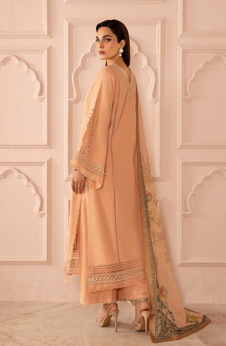 Back view of Peach Delight dress in soft lighting