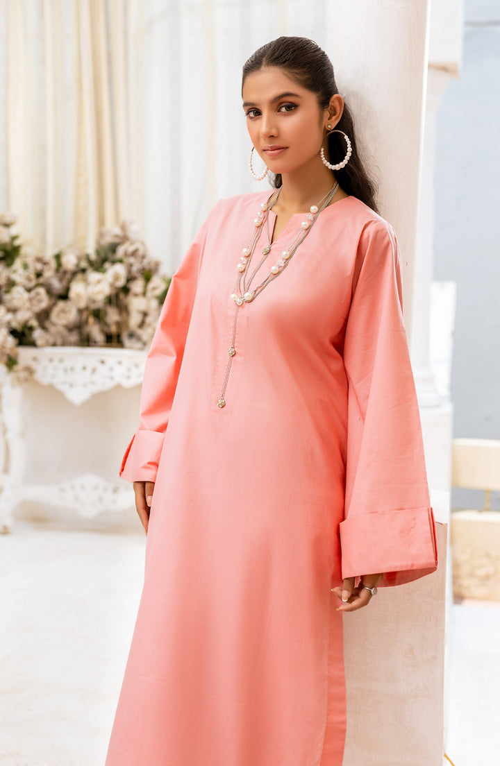 Close-up of Rosey Haze blush-toned fabric and embroidery